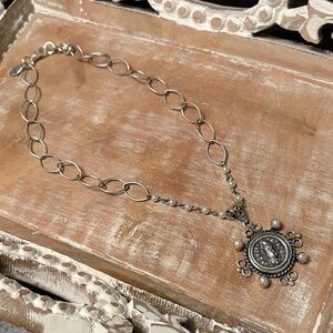 Sterling Silver Pendant with 4 white Pearls with an Impression of Mother Mary